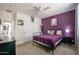 Comfortable bedroom showcasing a queen bed, carpeted floors, and modern decor at 14091 W Bloomfield Rd, Surprise, AZ 85379