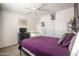 Bedroom with a queen bed, closet, and dark furniture at 14091 W Bloomfield Rd, Surprise, AZ 85379