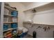 Walk-in closet with many items stored on shelves and carpeted floors at 14091 W Bloomfield Rd, Surprise, AZ 85379