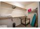 Walk-in closet with shelves, hanging racks, and carpeted floors at 14091 W Bloomfield Rd, Surprise, AZ 85379