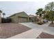 Single-Gathering home featuring desert landscaping, a two-car garage, and secure fencing at 14091 W Bloomfield Rd, Surprise, AZ 85379