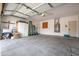Spacious garage with concrete floor, storage cabinets, and water heater at 14091 W Bloomfield Rd, Surprise, AZ 85379