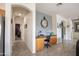 Hallway with a built in desk area with gray and tile flooring at 14091 W Bloomfield Rd, Surprise, AZ 85379
