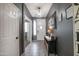 Stylish hallway with tiled flooring, a console table, and doorway views to other rooms at 14091 W Bloomfield Rd, Surprise, AZ 85379