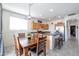 Open-concept kitchen with stainless steel appliances and an adjacent dining area at 14091 W Bloomfield Rd, Surprise, AZ 85379