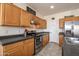 This kitchen is equipped with stainless steel appliances and ample cabinet space at 14091 W Bloomfield Rd, Surprise, AZ 85379
