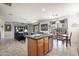 This kitchen with a center island flows nicely into the connected living spaces at 14091 W Bloomfield Rd, Surprise, AZ 85379