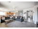 Open-concept living room with comfortable seating, stylish decor, and seamless flow to other areas at 14091 W Bloomfield Rd, Surprise, AZ 85379