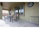 Outdoor patio area features a dining set and a wall clock at 14091 W Bloomfield Rd, Surprise, AZ 85379