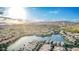 Panoramic aerial view of a beautiful lakeside community with homes, mature trees, and mountain views at 16226 S 11Th Pl, Phoenix, AZ 85048