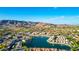 Scenic aerial view of a lakefront community showcasing lush landscaping and stunning mountain views at 16226 S 11Th Pl, Phoenix, AZ 85048