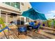 Backyard patio with an umbrella, fire pit, and outdoor furniture at 16226 S 11Th Pl, Phoenix, AZ 85048