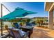 Inviting backyard with a fire pit, outdoor furniture and a stunning lake view at 16226 S 11Th Pl, Phoenix, AZ 85048