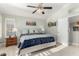 Cozy bedroom with neutral walls, ceiling fan, and a comfortable bed with lamps on nightstands at 16226 S 11Th Pl, Phoenix, AZ 85048