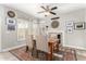 Elegant dining room with natural lighting, a decorative fireplace, and classic furnishings at 16226 S 11Th Pl, Phoenix, AZ 85048
