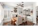 Bright dining room featuring a fireplace, shutters and classic furnishings, creating a warm atmosphere at 16226 S 11Th Pl, Phoenix, AZ 85048
