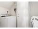 Bright laundry room with a washer and dryer and a storage door at 16226 S 11Th Pl, Phoenix, AZ 85048