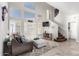 Spacious living room with high ceilings, abundant natural light from large windows, and comfortable furnishings at 16226 S 11Th Pl, Phoenix, AZ 85048