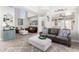 Open-concept living room featuring tile floors, comfortable seating, and an airy atmosphere at 16226 S 11Th Pl, Phoenix, AZ 85048