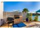 Covered outdoor patio features a built in stone countertop with a grill at 16226 S 11Th Pl, Phoenix, AZ 85048