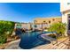 Sparkling pool area with cascading water feature surrounded by lush landscaping at 16226 S 11Th Pl, Phoenix, AZ 85048