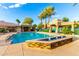 A clear blue pool with fountains sits in a beautiful outdoor setting, perfect for relaxation and recreation at 16226 S 11Th Pl, Phoenix, AZ 85048