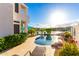 Backyard pool area with lush landscaping and scenic views of the lake and community at 16226 S 11Th Pl, Phoenix, AZ 85048