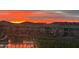 Picturesque sunset reflecting off the lake behind the community and illuminating the mountain backdrop at 16226 S 11Th Pl, Phoenix, AZ 85048