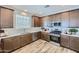 A kitchen featuring stainless steel appliances, ample countertop space, and plenty of natural light from the window at 16377 W Weeping Willow Rd, Surprise, AZ 85387