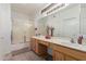 Bright bathroom with a double sink vanity, ample counter space, and a shower-tub combination at 18031 W Udall Dr, Surprise, AZ 85374