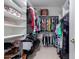Walk-in closet with ample shelving and hanging space for organized storage at 18031 W Udall Dr, Surprise, AZ 85374