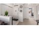 Bright foyer with neutral tones, coat closet, tile floor, and a view into the home at 18031 W Udall Dr, Surprise, AZ 85374