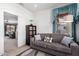 Cozy living room with a comfortable sofa, neutral color scheme, and stylish decor at 18031 W Udall Dr, Surprise, AZ 85374