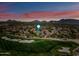 Scenic aerial view of the golf course community with mountain views at sunset in Scottsdale, Arizona at 20750 N 87Th St # 2038, Scottsdale, AZ 85255