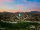 Scenic aerial view of the golf course community with mountain views at sunset in Scottsdale, Arizona at 20750 N 87Th St # 2038, Scottsdale, AZ 85255