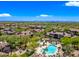Aerial view featuring a community pool, spa, and outdoor lounge areas at 20750 N 87Th St # 2038, Scottsdale, AZ 85255