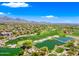 Stunning aerial view of a golf course community with lush green fairways and water features at 20750 N 87Th St # 2038, Scottsdale, AZ 85255