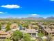 Stunning aerial view of the golf course community with lush landscaping and tile roofs in Scottsdale, Arizona at 20750 N 87Th St # 2038, Scottsdale, AZ 85255