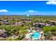 Aerial view featuring a community pool, spa, and outdoor lounge areas at 20750 N 87Th St # 2038, Scottsdale, AZ 85255