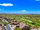 Scenic aerial view of a golf course community under a bright blue sky at 20750 N 87Th St # 2038, Scottsdale, AZ 85255