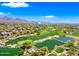 Stunning aerial view of a golf course community with lush green fairways and water features at 20750 N 87Th St # 2038, Scottsdale, AZ 85255