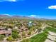 Aerial view of a desert community with a golf course and mountain views at 20750 N 87Th St # 2038, Scottsdale, AZ 85255