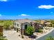 Aerial view of the exterior elevation including the three-car garage and landscaped surroundings in Scottsdale, Arizona at 20750 N 87Th St # 2038, Scottsdale, AZ 85255