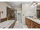 Elegant bathroom featuring double sinks, shower and a soaking tub at 20750 N 87Th St # 2038, Scottsdale, AZ 85255