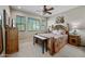 Charming bedroom featuring a ceiling fan, window views and rustic wood accents at 20750 N 87Th St # 2038, Scottsdale, AZ 85255
