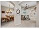 Open dining area with rustic wood table, two chandeliers, and carpeted floors at 20750 N 87Th St # 2038, Scottsdale, AZ 85255