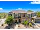 Stunning two-story home with stone accents, a tile roof, and a three-car garage in Scottsdale, Arizona at 20750 N 87Th St # 2038, Scottsdale, AZ 85255