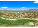 Beautiful aerial view of a scenic golf course with lush green fairways and sand traps in Scottsdale, Arizona at 20750 N 87Th St # 2038, Scottsdale, AZ 85255