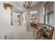 Elegant hallway with archways, leading to a dining area, with stylish furnishings at 20750 N 87Th St # 2038, Scottsdale, AZ 85255
