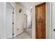 Hallway with storage and neutral walls, carpeting, sconce lighting and white doors, creating a welcoming transition between spaces at 20750 N 87Th St # 2038, Scottsdale, AZ 85255